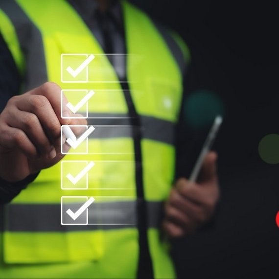 Engineer verifying a digital checklist